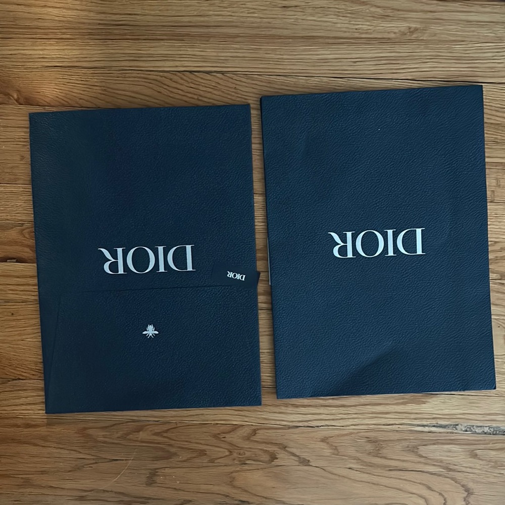 This is a Dior envelope packaging. It would hold a T-shirt or a thin sweater.